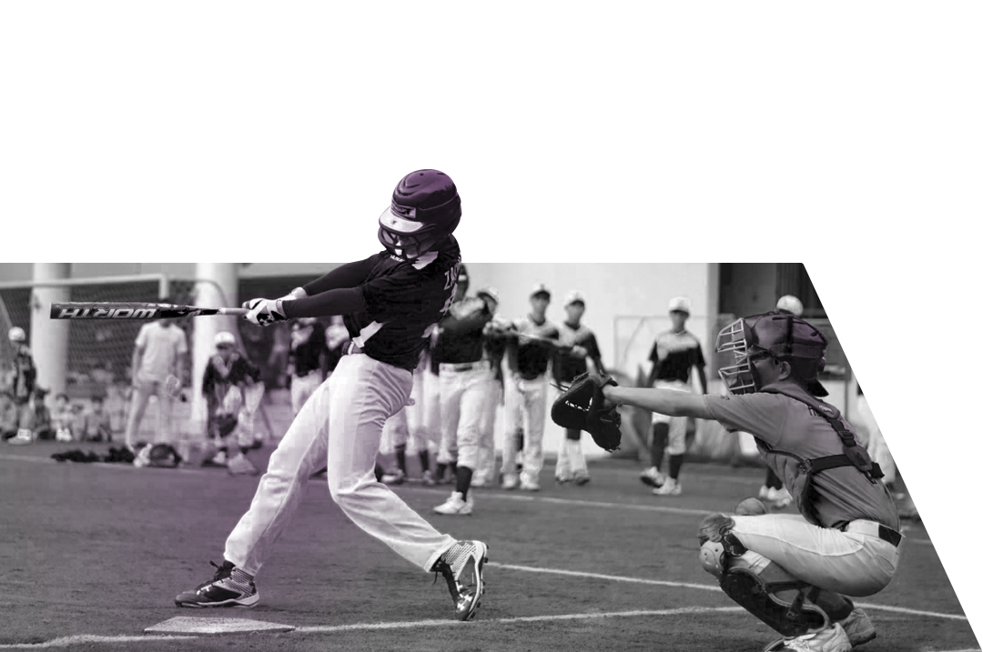 youth hitting a ball during a baseball game